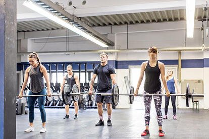 Adults Strength Training in Gym