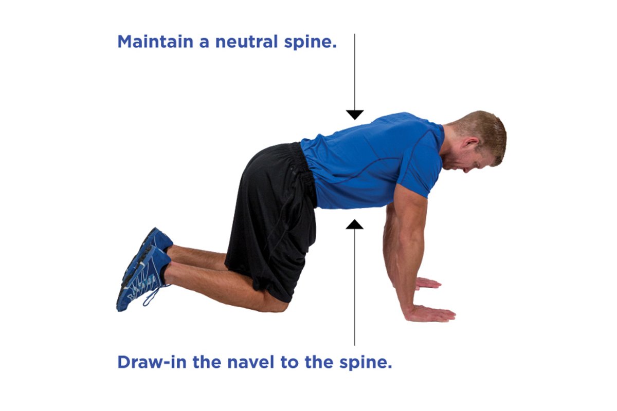 trainer showing how to maintain a neutral spine